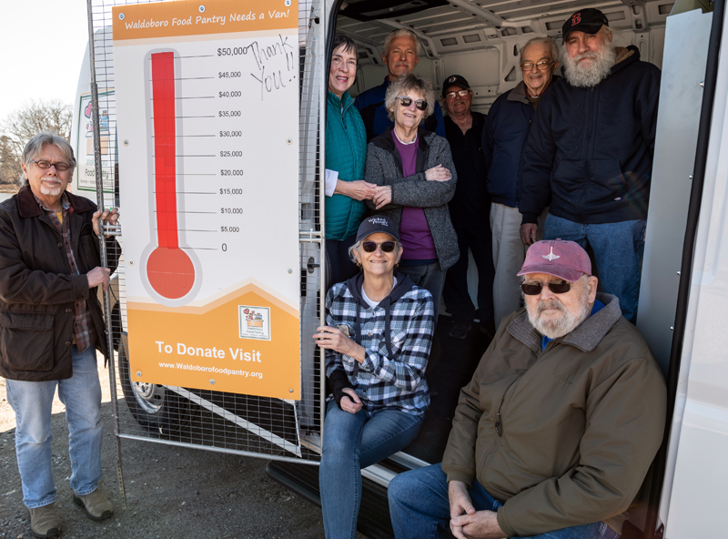 From left: Jan Visser, Nancy Lippert, Natalie Masse, Dale Turner, Janet Lee, Lenny Ryan, Bill Blodgett, Meyer Drapkin, and Jeff Brown show off the cargo capacity of the Waldoboro Food Pantry’s new van in Waldoboro on April 4. Individuals and local businesses donated over $50,000 to make the van a reality. (Bisi Cameron Yee photo)