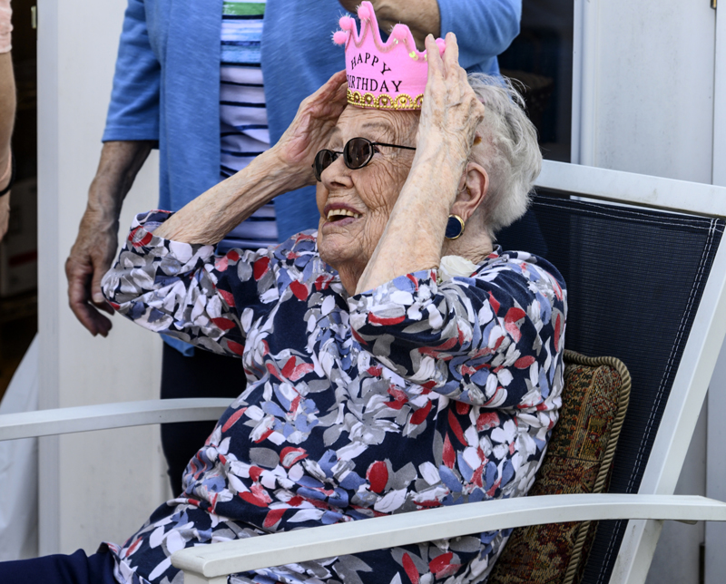 Eleanor Mitchell adjusts her birthday crown during her 100th birthday party in Damariscotta on Saturday, May 14. (Bisi Cameron Yee photo)
