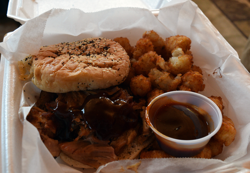 An order of a pulled pork sandwich with a side of tater tots from Gators Deep South BBQ in Damariscotta. Owner Christian "Chris" Grant prefers to use a dry rub for his barbecue and serve his homemade barbecue sauce on the side. (Evan Houk photo)