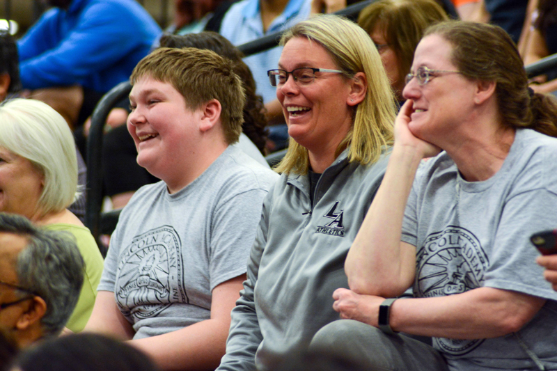 Freshman C.J. Colomb with coaches Shelly Richardson and Sue Levesque watch the action at the Robotics World Championships. (Photo courtesy Izzy Petersen)