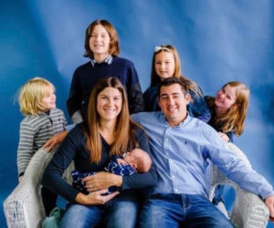 The Clark/Hunter family poses for a photo with newborn son Finnegan. The blended family had adopted two of their children when faced with difficulty having another child of their own. (Photo courtesy Alicia Hunter)