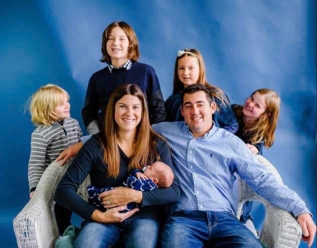 The Clark/Hunter family poses for a photo with newborn son Finnegan. The blended family had adopted two of their children when faced with difficulty having another child of their own. (Photo courtesy Alicia Hunter)