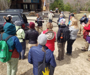 Bambi Jones demonstrates forestry tools to the Women Owning Woodlands participants. (Photo courtesy Maddie Eberly)