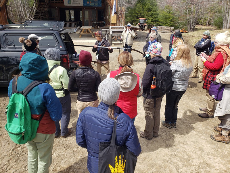 Bambi Jones demonstrates forestry tools to the Women Owning Woodlands participants. (Photo courtesy Maddie Eberly)