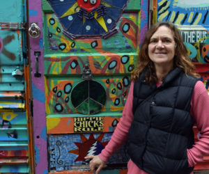 Cary Huggins stands in front of her popular Airbnb, "Hippy Bus," on April 26. Huggins offers various places to stay on her property on Westport Island and is working to restart a Trips with Kids bicycling program this year. (Evan Houk photo)