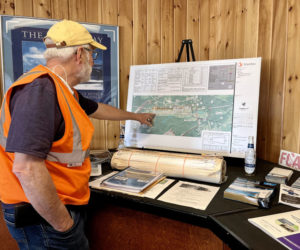 Wiscasset Municipal Airport Manager Rick Tetrev points to a plan of the runway in his office. (Anna M. Drzewiecki photo)