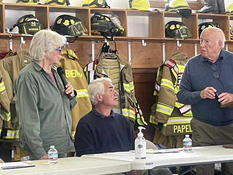 Meeting moderator Don Means (right) appears ready to resume his speaking role as Bremen Selectman Wendy Pieh finishes answering a question during Bremens annual town meeting on Saturday, June 18. Selectman John Boe Marsh is seated between the two. (Sherwood Olin photo)