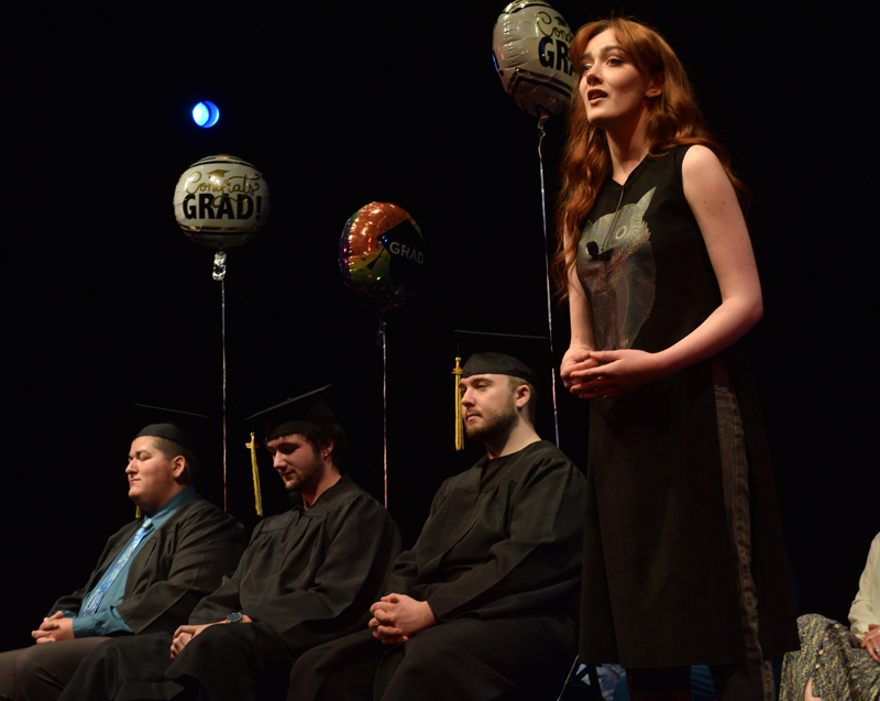 Honora Boothby, a member of the Central Lincoln County Adult Education class of 2021, reprises her performance of Meadowlark from the musical The Bakers Wife" at the 2022 commencement ceremony on Tuesday, June 7. More than 40 people attended the ceremony at the Lincoln Theater to celebrate with the six graduates. (Evan Houk photo)