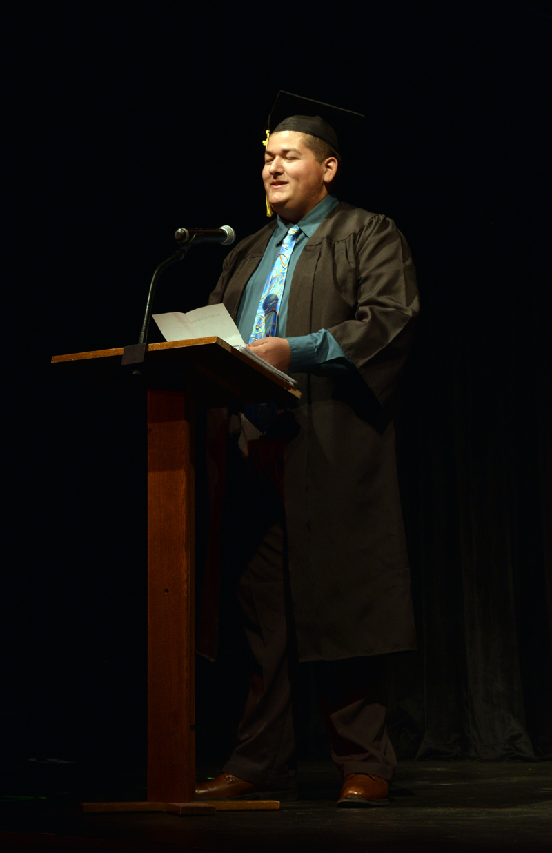 Matthew Baker, a 2022 graduate of Central Lincoln County Adult Education, tells the crowd at the Lincoln Theater about his experiences being homeschooled during the 2022 commencement ceremony on Tuesday, June 7. Baker was one of six graduates in this year's class. (Evan Houk photo)
