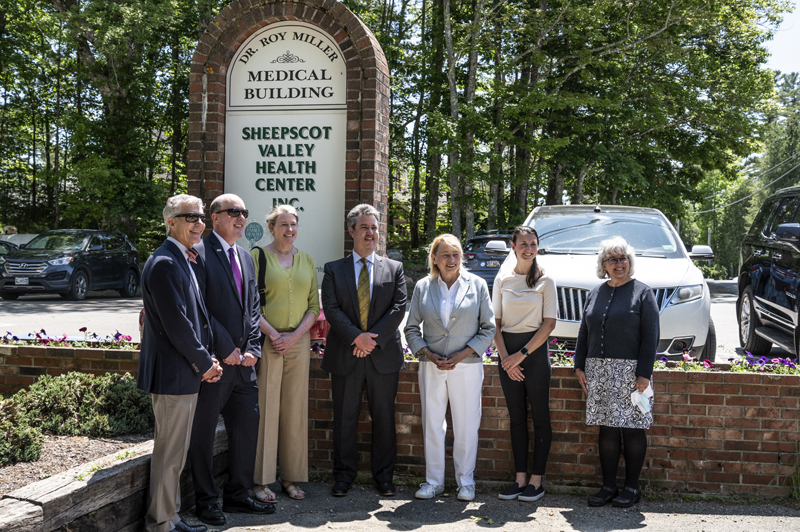 From left: Andrew MacLean, of the Maine Medical Association; Bill Norbert, of Finance Authority of Maine; Jeanne Lambrew, commissioner of the Maine Department of Health and Human Services; Brian Wyatt, of the Maine Primary Care Association; Maine Gov. Janet Mills; Family Nurse Practitioner Natalie Ledue; and Connie Coggins, president and CEO of HealthReach Community Health Centers, pose for a photo outside the Sheepscot Valley Health Center in Whitefield on Tuesday, June 7. The health center was the first stop on Mill's tour of Lincoln County. (Bisi Cameron Yee photo)
