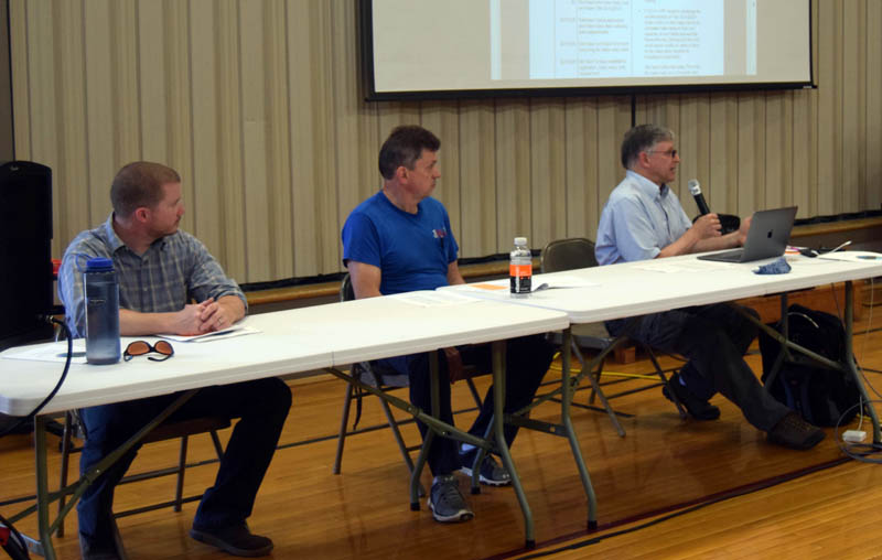 Somerville Select Board members Jarad Greeley, Don Chase, and Chris Johnson (left to right) face the voters during the Somerville annual town meeting Sunday June 26. (Alec Welsh photo)