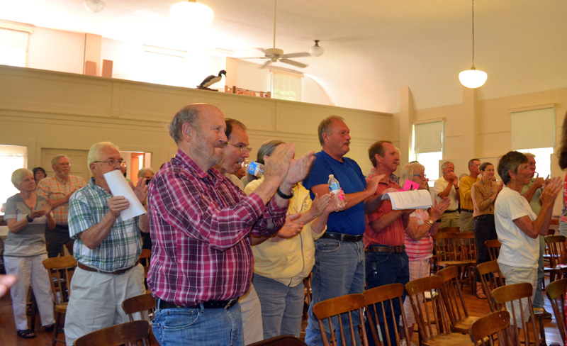 Westport Island voters give outgoing longtime First Selectman George Richardson Jr. a standing ovation at the annual town meeting on Saturday, June 25. (Charlotte Boynton photo)