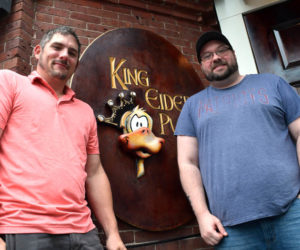 The new owners of King Eider's Pub, former employees Scott McArdle and Damon Waltz, stand outside the downtown Damariscotta establishment on Monday, July 25. The duo said they want to keep the pub largely the same initially because they "love what it is." (Evan Houk photo)