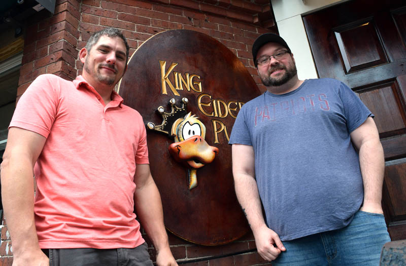 The new owners of King Eider's Pub, former employees Scott McArdle and Damon Waltz, stand outside the downtown Damariscotta establishment on Monday, July 25. The duo said they want to keep the pub largely the same initially because they "love what it is." (Evan Houk photo)