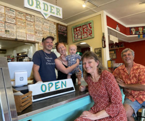 After 30 years and two generations of family ownership, S. Fernald's Country Store in Damariscotta seeks new owners. From left: Current owners Sumner Fernald Ricky Richards IV and Moira Rose Rosie Richards, their son Sumner Fernald "Sunny" Richards IV, Pam Jackman, and Sumner Fernald Richards III. (Maia Zewert photo)
