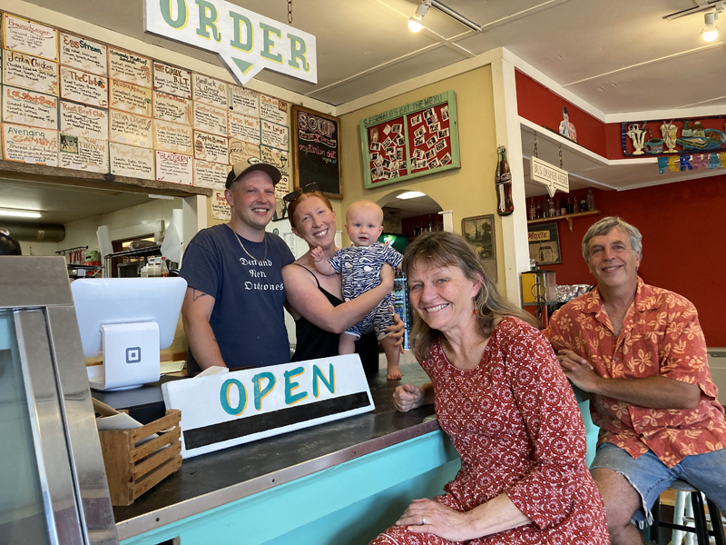 After 30 years and two generations of family ownership, S. Fernald's Country Store in Damariscotta seeks new owners. From left: Current owners Sumner Fernald Ricky Richards IV and Moira Rose Rosie Richards, their son Sumner Fernald "Sunny" Richards IV, Pam Jackman, and Sumner Fernald Richards III. (Maia Zewert photo)