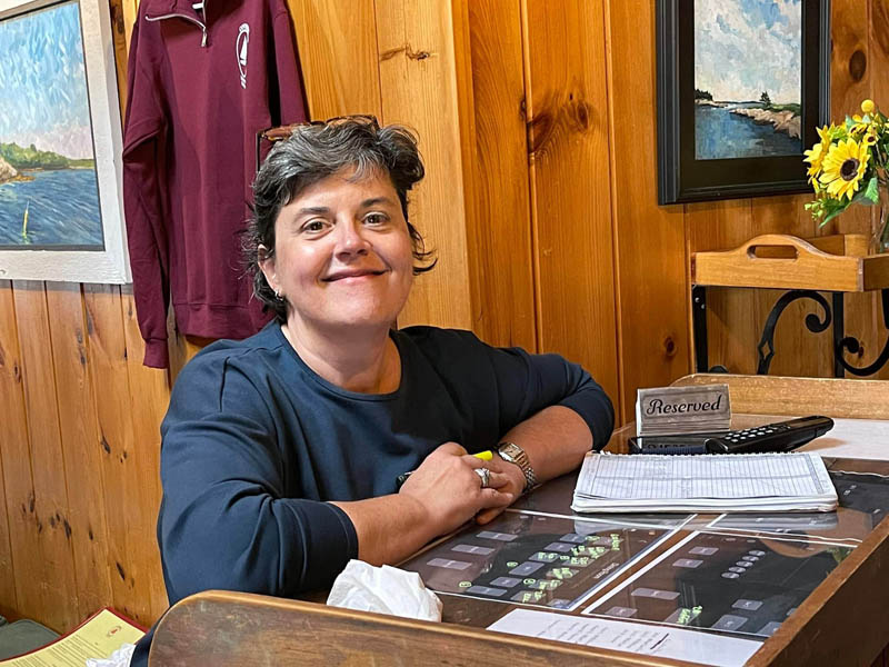 King Eiders Pub co-owner Sarah Maurer stands at the hostess stand at Coveside Restaurant and Marina on Tuesday, July 5. Maurer didnt hesitate to lend a hand to help another restaurateur out of a tough spot. (Photo courtesy Coveside Restaurant and Marina)