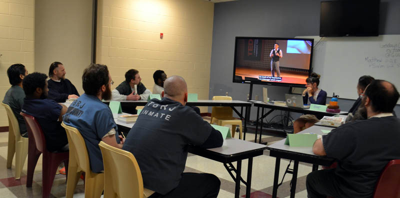 Two Bridges Regional Jail inmates watch video of Phuc Tran, author of "Sign, Gone," the book they are reading for a six-week book club on Wednesday, June 22. (Charlotte Boynton photo)