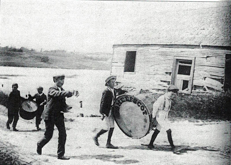 "Trinket Joe" Leighton captured this scene of a parade coming off the bridge in Sheepscot. (E. Joseph Leighton Collection, Lincoln County Historical Association)