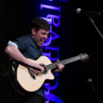 Virtuoso Guitarist Shane Hennessy on Stage in Boothbay Harbor