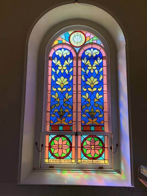 Ten stained glass windows in St. Patrick's Church were removed and sent to Rohlfs Stained and Leaded Glass in New York to be restored. The plexiglass installed to protect the historic windows did not allow for proper air circulation which contributed to heat damage. (Photo courtesy Roman Catholic Diocese of Portland)