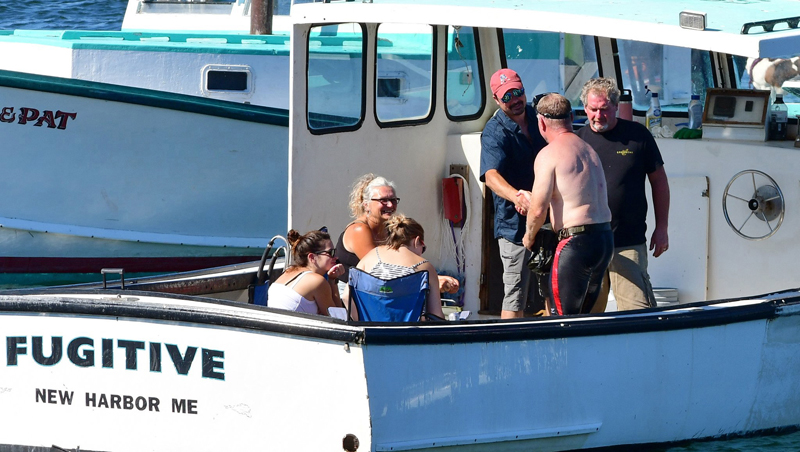 Bristol Republican Ed Thelander makes a campaign stop aboard Dexter Benner's lobster boat during the Olde Bristol Day Merritt Brackett Lobster Boat Races at Sunday, Aug. 14. A retired navy Seal, Thelander works occasionally as a commercial diver. Water is a way to get someplace and it definitely filters out a whole bunch of people, because water is a very limiting factor, Thelander said. (Photo courtesy Sherrie Tucker)