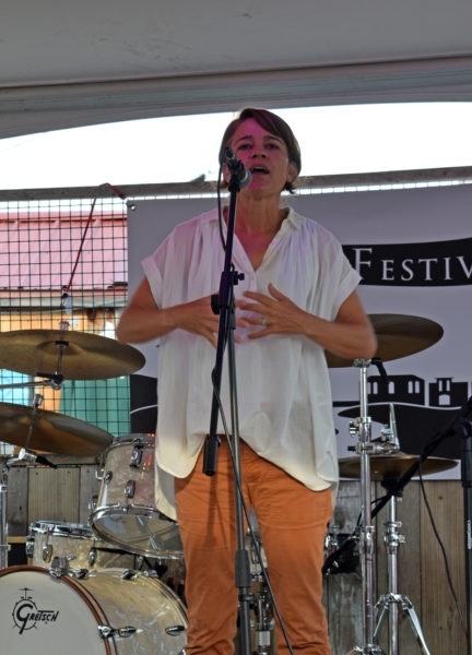 Actor Anna Belknap, Lincoln Academy class of 1990, speaks to the need for more art and more artists during the inaugural Linaca Music Festival at Schooner Landing in Damariscotta on Friday, Aug. 5. The organizers of the festival hope to make it a yearly event to showcase local talent. (Evan Houk photo)