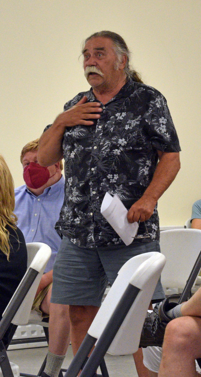 Dresden resident Neal Amirault speaks in favor of appropriating $200,000 for a revaluation of properties in town during a special town meeting on Tuesday, Aug. 30. This is just, to me, making life fair for everyone," he said. (Evan Houk photo)