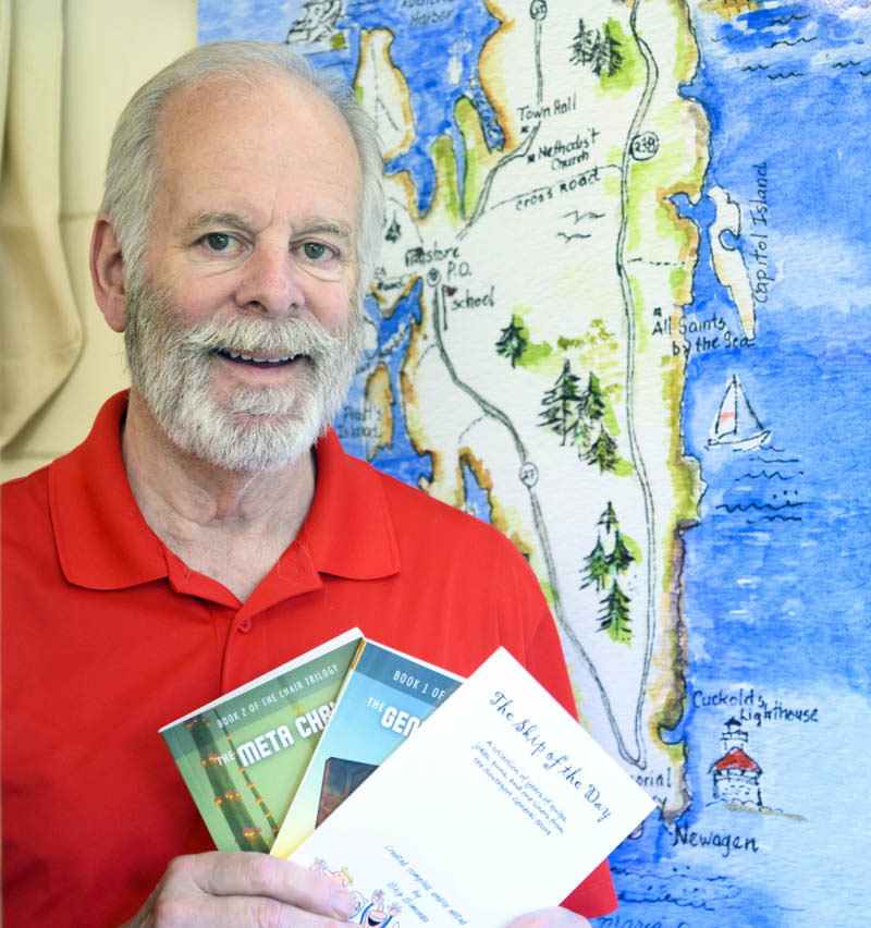 Skip Simonds holds a selection of his writing while standing for a photo in front of a map of Southport at the town's general store on June 30. He is currently working on the third book of his science fiction series, but "The Skip of the Day" is the local bestseller. (Bisi Cameron Yee photo)
