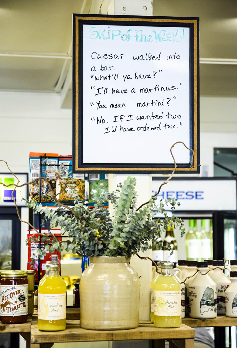 A dry erase board holds "The Skip of the Week" at the Southport General Store on Aug. 3. The small witticisms have become a ritual part of any visit for many of the store's customers. (Bisi Cameron Yee photo)