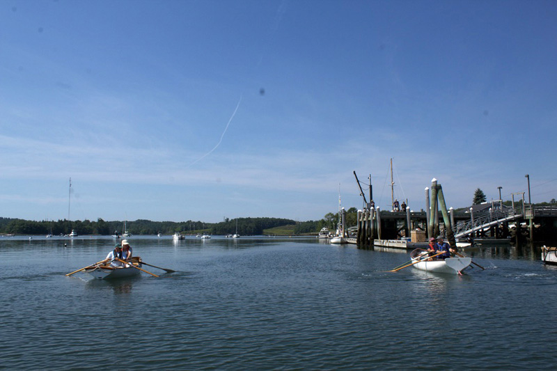 The two winning rowing teams, Steve Erskin and Allan Boyes (left boat) and David Pope and Dan Watts cross the finish line during Schoonerfests first annual rowing race. (Iris Pope photo)