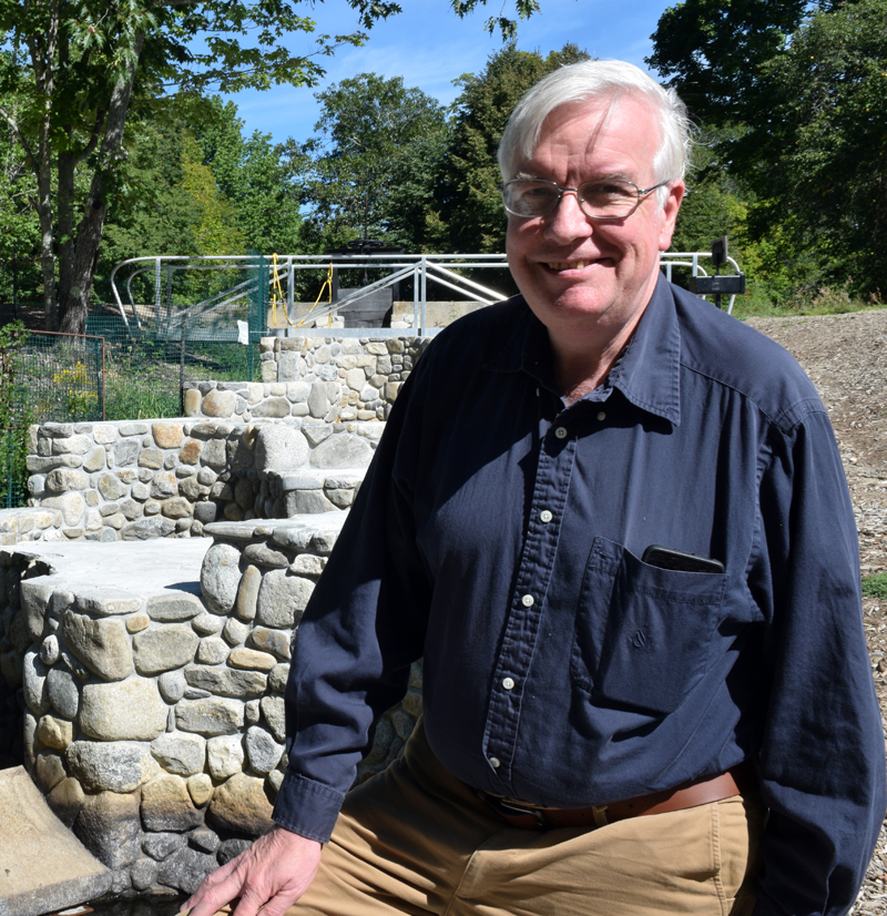 Bristol Town Administrator Chris Hall stands in front of the Bristol Mills Fish Ladder, one of the major projects completed during his six-year tenure, on Saturday, Sept. 3. Hall will be retiring from the sixth different career he has had during his life, town administrator, at the end of the year. (Evan Houk photo)
