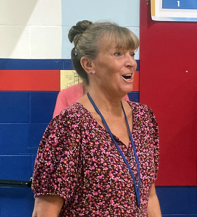 Great Salt Bay Community School art teacher Karen Hight reacts as she learns she is the guest of honor at a school assembly on Friday, Sept. 23. Hight was one of the 10 art teachers from around the country to receive the Prang Art Teacher of the Year Award. (Sherwood Olin photo)