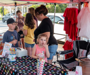 Junior members of Partners in Education sell lemonade while parents talk with visitors about Wiscasset Elementary School activities during the August Art Walk. (Photo courtesy Bob Bond)