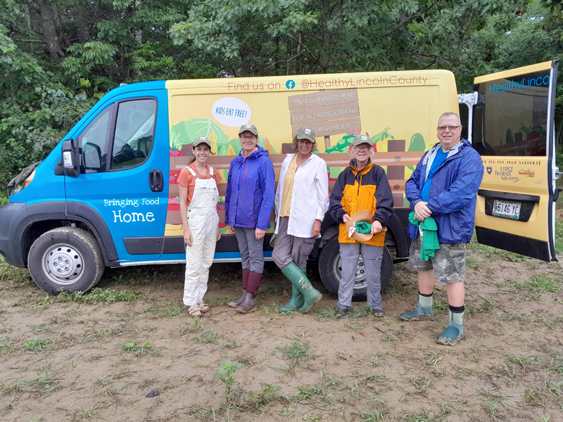 The Lincoln County Gleaners, a group of produce harvesting volunteers organzied by Healthy Lincoln County pose in front of the Bringing Food Home van, Lulu. (Photo courtesy Healthy Lincoln County)