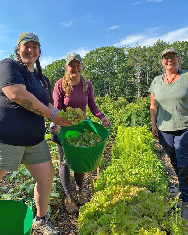 Aspiring horticulturist Jess Breithaupt (center) poses with Kelsey and Justine at Veggies to Table farm. (Photo courtesy Healthy Lincoln County)