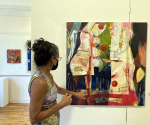 Celeste June Henriquez discusses her work in the Maine Art Gallery exhibit currently on view in Wiscasset. (Photo by Wendy Ross)