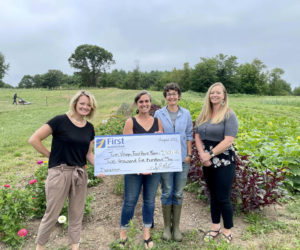 First National Bank representatives Alyssa Allen and Jessica Day present Twin Village Foodbank Farm representatives Megan Taft and Sara Cawthon with a $2,500 donation. From left: Allen, Taft, Cawthorn, and Day. (Photo courtesy The First Bancorp)