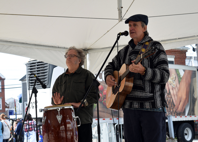 Nat Hussey (right) performs with Carl Root on percussion during the Damariscotta Pumpkinfest & Regatta on Sunday, Oct. 9. Hussey writes and records original material and practices law in Damariscotta. (Evan Houk photo)