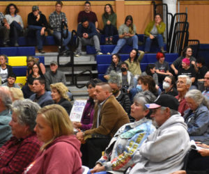 Audience members in the Medomak Middle School gymnasium listen to public comment about the proposed removal of "Gender Queer: A Memoir" from the high school's library. Over 250 attendees appeared at the meeting in person and by video. (Elizabeth Walztoni photo)
