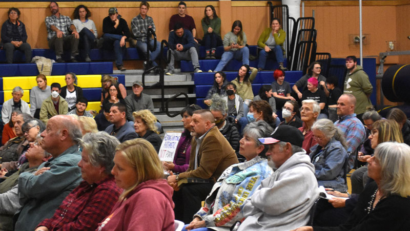 Audience members in the Medomak Middle School gymnasium listen to public comment about the proposed removal of "Gender Queer: A Memoir" from the high school's library. Over 250 attendees appeared at the meeting in person and by video. (Elizabeth Walztoni photo)