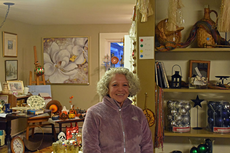 Good Things Thrift & Craft Shop's Manager Terri Stred, of Warren, stands among donated goods for sale on the first floor of the Waldoboro business. Stred said that working in the shop is a local cycle of receiving donations and sending them out to new homes. (Elizabeth Walztoni photo)