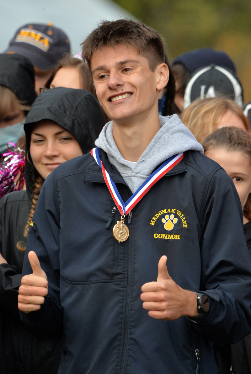 Connor Daigle sports two thumbs-up after winning the 2021 state Class B cross country championship. (Paula Roberts photo, LCN file)
