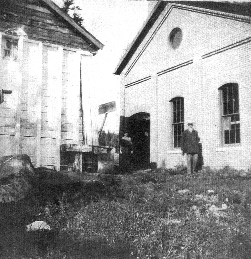 William J. Knowlton in 1902, shown down by the pump house where the town water was pumped from Little Pond up the hill to the stand pipe. Mrs. William J. Knowlton is in the background. (Photo courtesy Calvin Dodge)