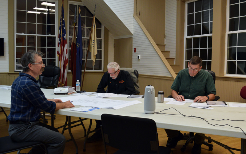 From left: Darin Carlucci, chair of the Bristol School Committee, speaks to Selectmen Paul Yates and Chad Hanna about a $6 million-plus plan for the renovation of Bristol Consolidated School on Wednesday, Oct. 19. The committee plans to present a firm bid to the select board by the end of the year and bring the proposal to voters at the annual town meeting in March. (Evan Houk photo)