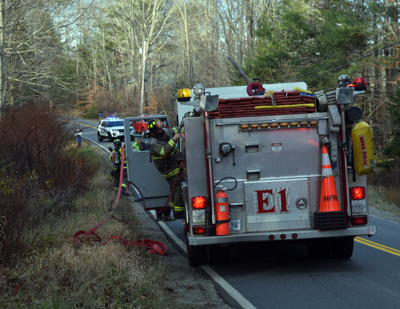 Nobleboro firefighters work the scene of a head-on collision on East Pond Road in Nobleboro the afternoon of Tuesday, Nov. 15. The crash closed a portion of East Pond Road. (Evan Houk photo)
