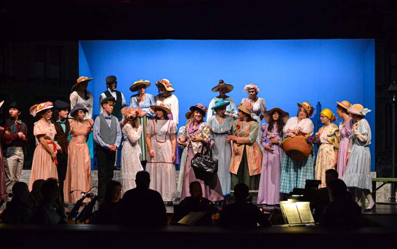 Lily Rogers leads the ensemble in the opening act of the Medomak Valley High School Players' production of "Hello, Dolly!" (Lydia Simmons photo)