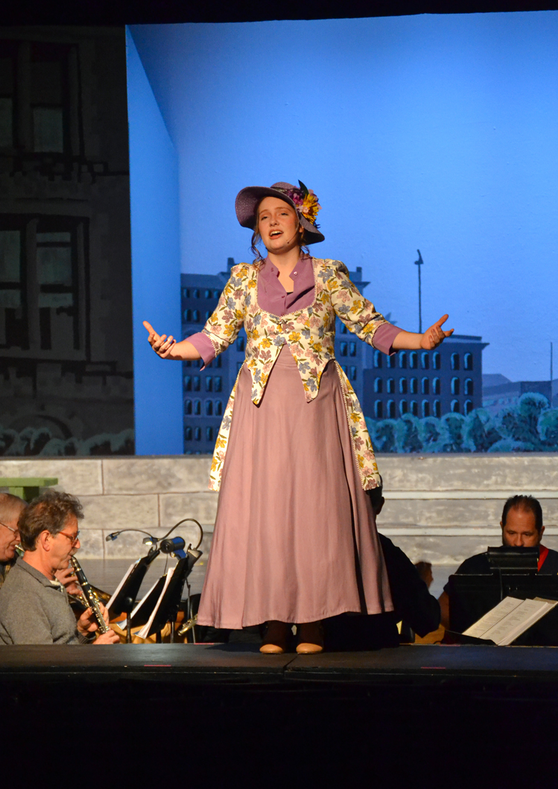 Lily Rogers sings onstage while portraying Dolly Levi in the Medomak Valley High School Players' production of "Hello, Dolly!" (Lydia Simmons photo)