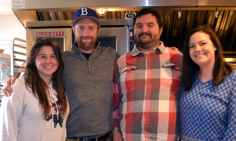 The owners and operators of the new Back River Bistro, located at 65 Gardner Road in Wiscasset, prepare for opening day. From left: business owners Corrinna and Matthew Stum, Chef Aaron Hansen, and Operations Manager Alison Hansen. (Charlotte Boynton photo)
