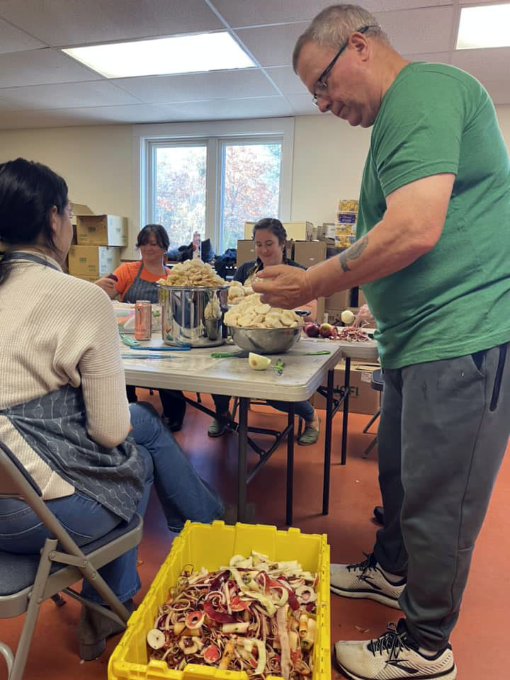Volunteers from the Lincoln County Gleaners at work making applesauce in Damariscotta. (Photo courtesy Healthy Lincoln County)